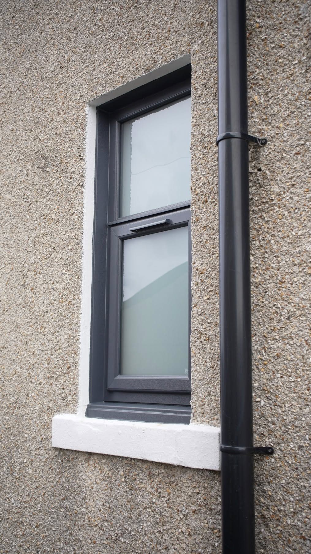 Close-up of a new anthracite grey window fitted in a Lochgelly home by Eco Glaze Scotland