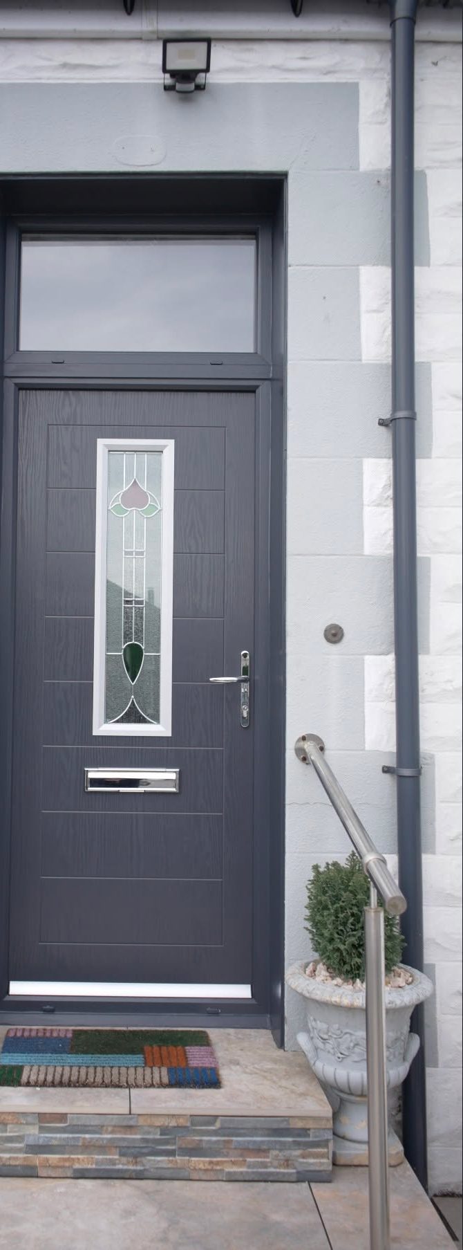 New anthracite grey front door with a decorative glazed panel, fitted in Lochgelly by Eco Glaze Scotland