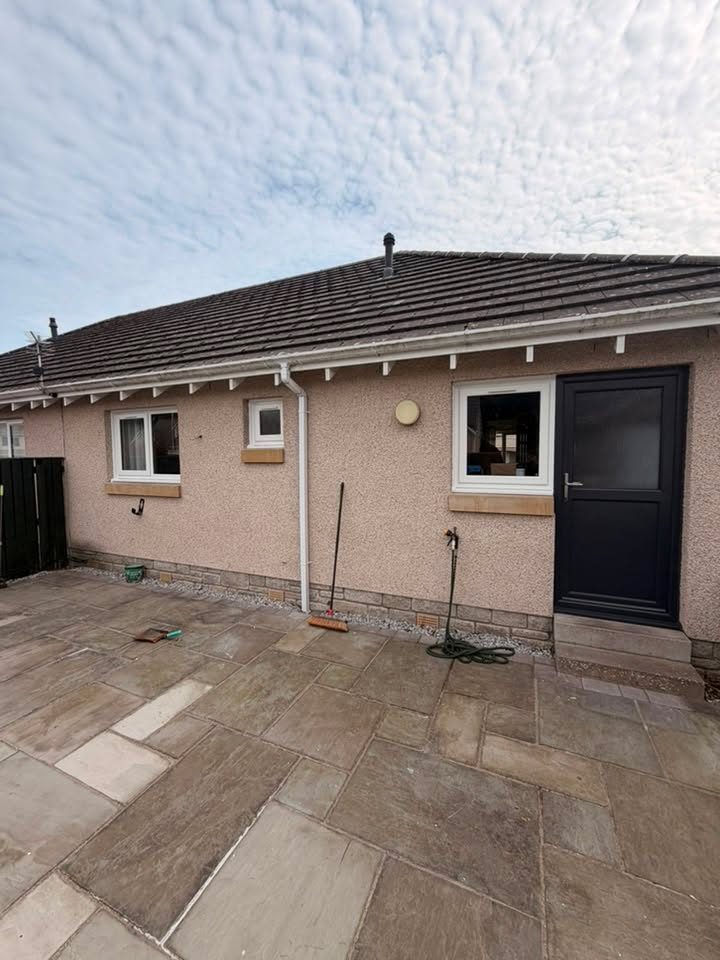 New anthracite uPVC back door and white windows at the rear of a home in Arbroath